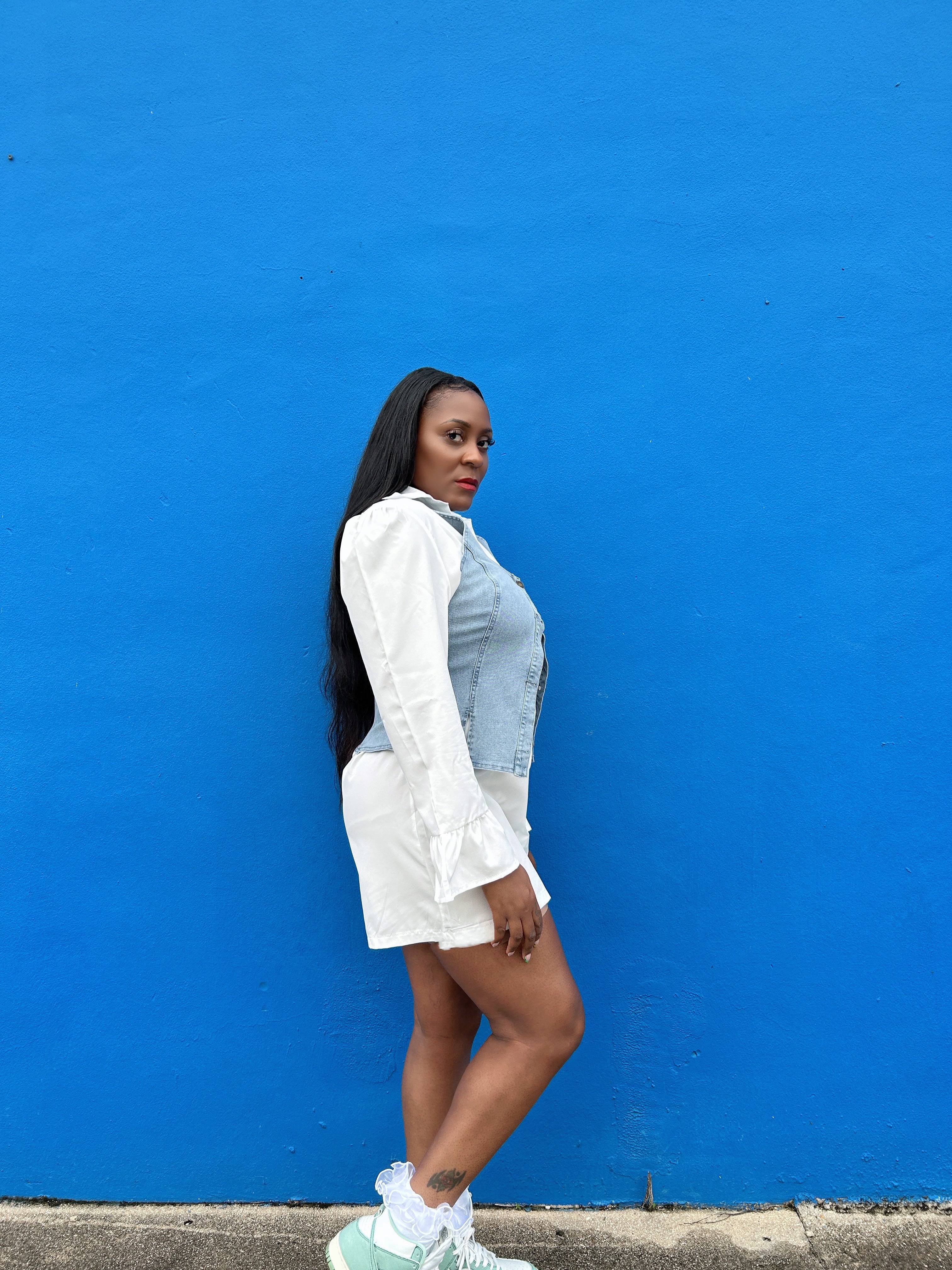   denim vest on top of a white dress that is long sleeve for women featuring a comfortable fit and chic casual style.