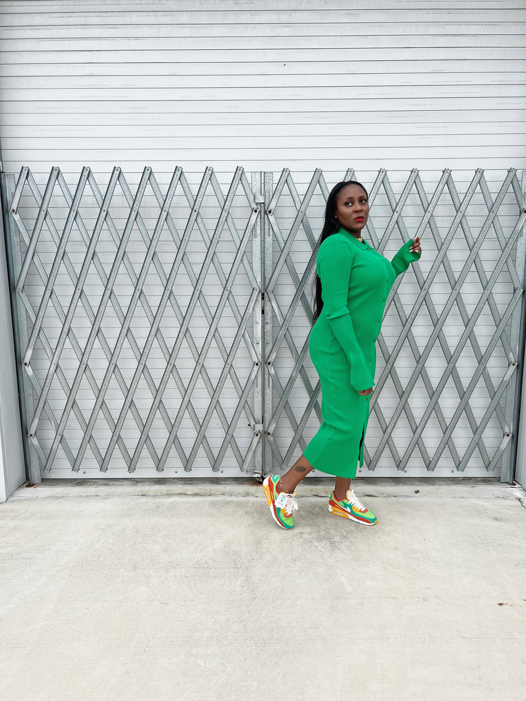 Stylish ribbed green maxi dress with a fitted silhouette, button-up front, and flowy bell sleeves.”