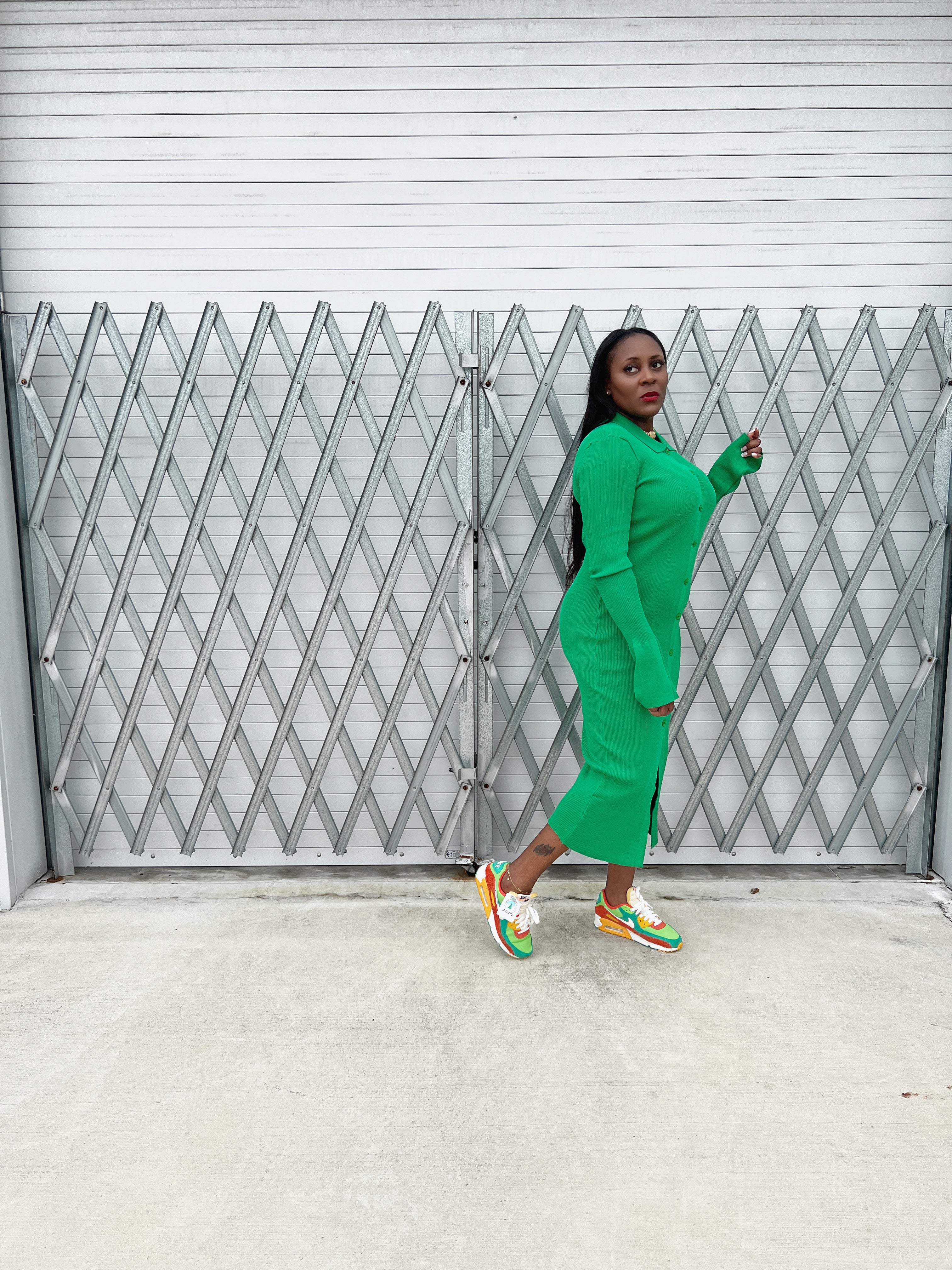 Stylish ribbed green maxi dress with a fitted silhouette, button-up front, and flowy bell sleeves.”