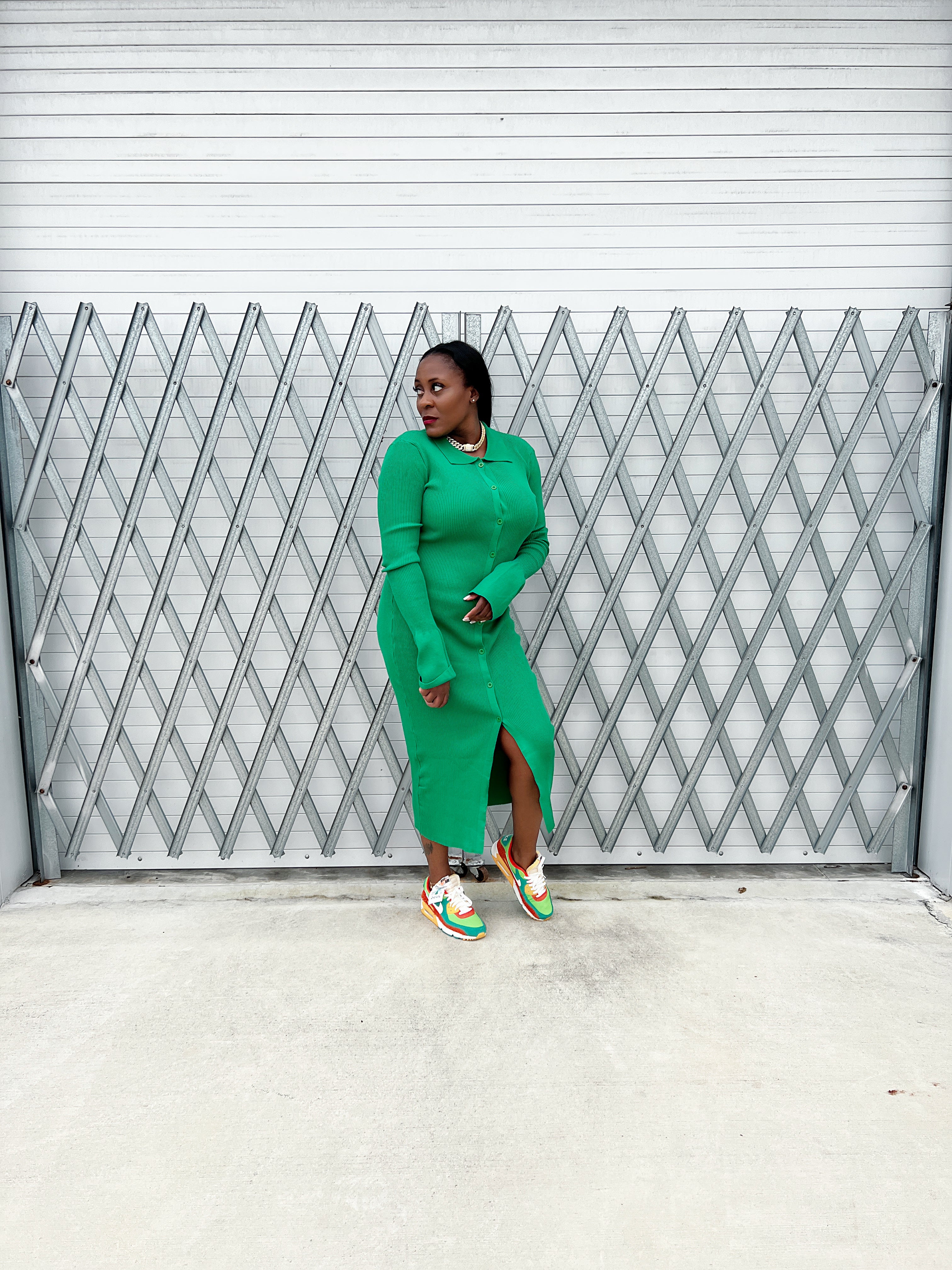 Stylish ribbed green maxi dress with a fitted silhouette, button-up front, and flowy bell sleeves.”