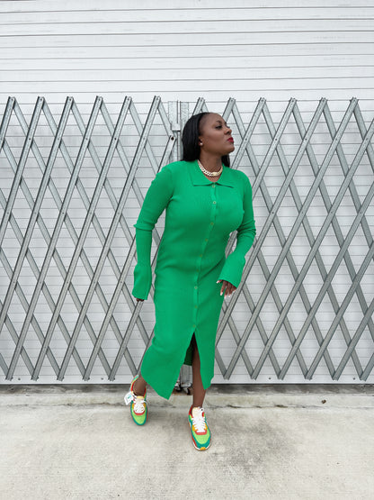 Statement bell sleeves on a ribbed green maxi dress, adding elegance and movement to the design.