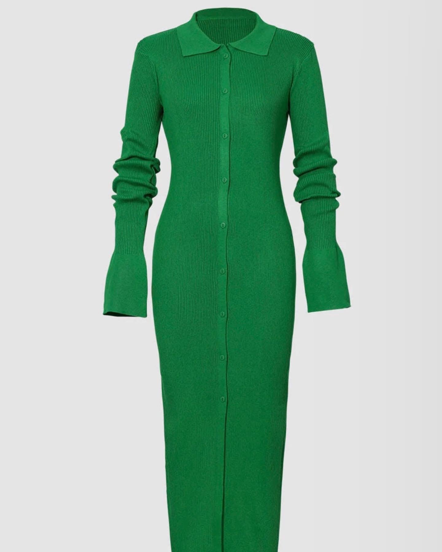 Statement bell sleeves on a ribbed green maxi dress, adding elegance and movement to the design.