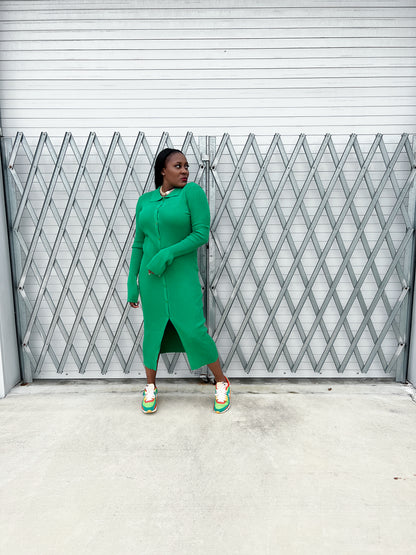 Detailed view of the collared neckline and button-up design on a green ribbed maxi dress for women.