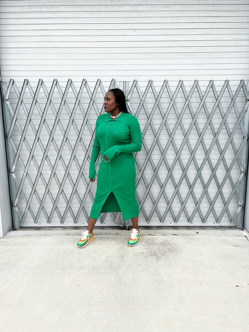 Stylish ribbed green maxi dress with a fitted silhouette, button-up front, and flowy bell sleeves.”