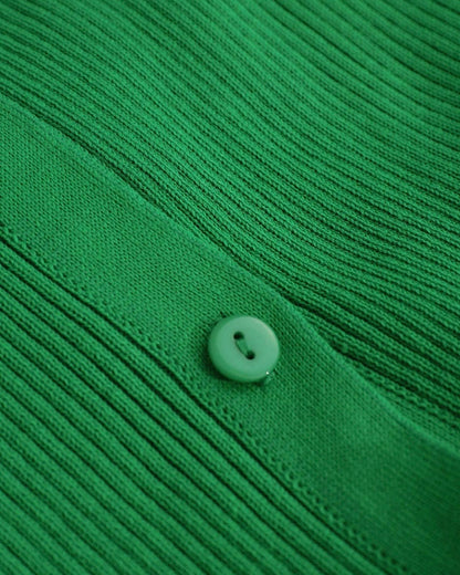 Statement bell sleeves on a ribbed green maxi dress, adding elegance and movement to the design.